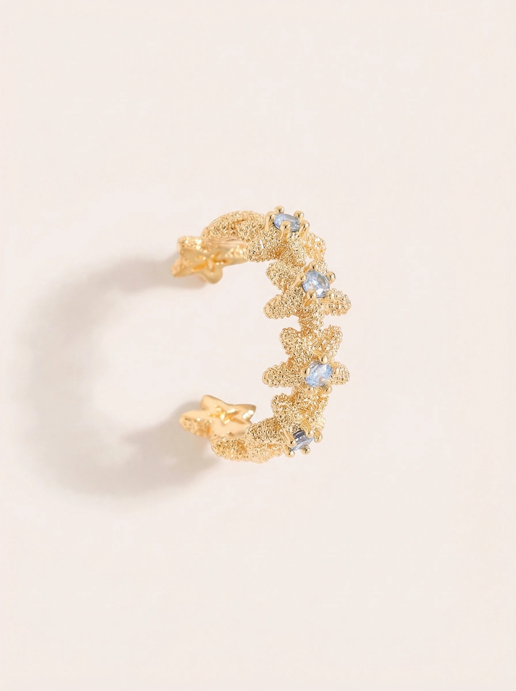 Viele Seesterne mit blauer Zirkonia Vergoldete Ear-Cuffs