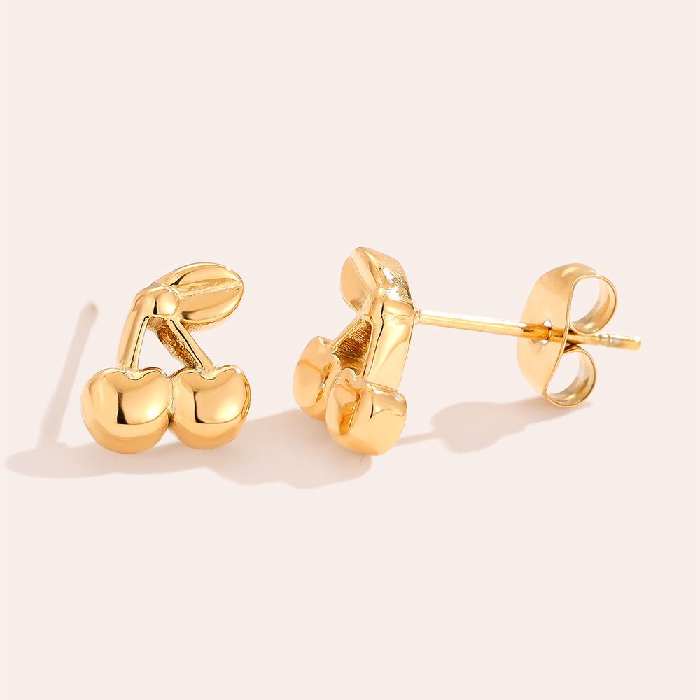 Goldene Edelstahl-Ohrringe in Kirschenform, glänzende Oberfläche, detailreiches Design