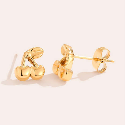 Goldene Edelstahl-Ohrringe in Kirschenform, glänzende Oberfläche, detailreiches Design