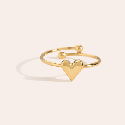 Goldfarbener Edelstahlring mit Herzmotiv und offenem Design, zwei Kugelenden