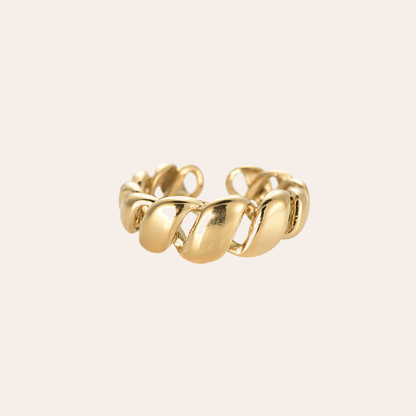 Goldfarbener Edelstahlring mit gedrehtem Design, offene Form, glänzende Oberfläche