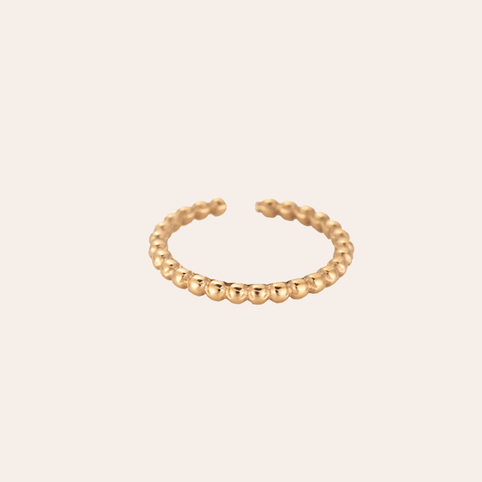 Goldfarbener Edelstahlring mit Punktdesign, offene Form, minimalistischer Stil