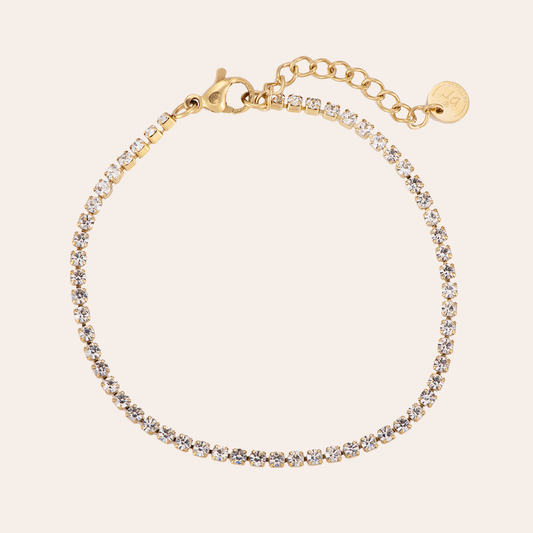 Goldfarbenes Edelstahl-Tennisarmband mit funkelnden Steinen, feine Gliederkette, verstellbarer Verschluss